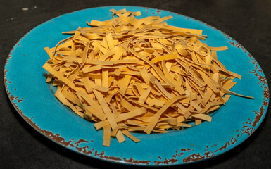 egg noodles on a blue plate 