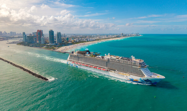 Miami, Florida, USA - May 11, 2025: Norwegian Escape cruise ship voyage. Cruise in summer vacation. NCL. Norwegian cruise line. Cruise ship tour and travel at sea. Ship leaving Miami beach port