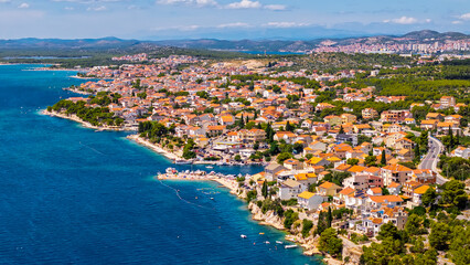 Aerial view of Brodarica coastal village near Sibenik Bridge Croatia with Adriatic Sea and Mediterranean houses