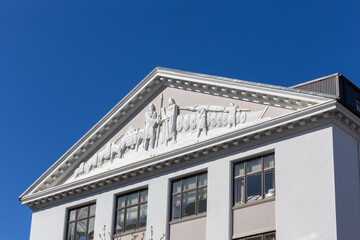 Fototapeta premium Reykjavik, Iceland, 14.05.22. Classical pediment relief with Viking history on historical building in Reykjavik Iceland.