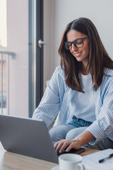 Successful virtual teamwork. Laughing gen z girl remote employee blended learning student...