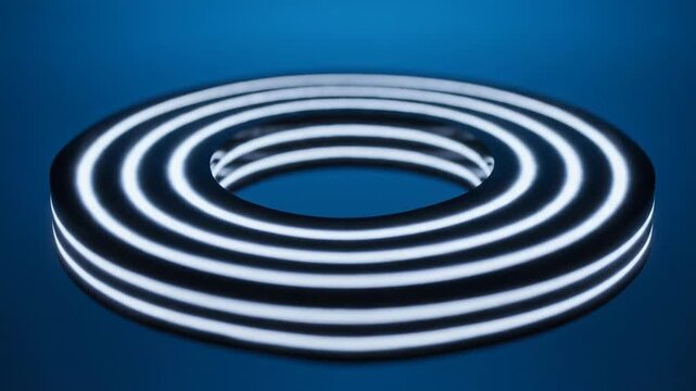 Abstract glowing torus shape pulses with light. Futuristic digital design on a deep blue background.