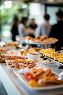 Corporate breakfast catering setup at seminar with colleagues networking in background