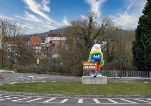 Figure inspired by the famous Smurfs as an entrance sign to the town of Pola de Siero, nown as Pitufina karateca, Asturias, Spain