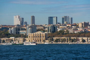 Fototapeta premium A stunning view of Istanbul’s waterfront featuring the historic Dolmabahçe Palace along the Bosphorus Strait.