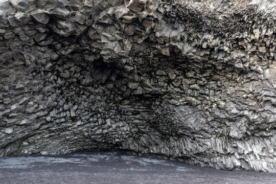 Halsanefshellir Cave basalt columns vault interior view at Reynisfjara Black Sand Beach, Iceland