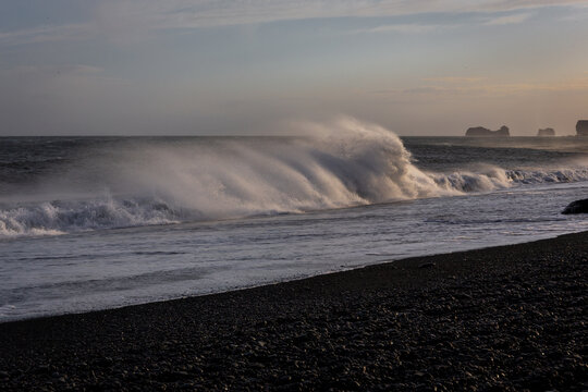 Dangerous sneaker waves crashing on Reynisfjara Black Sand Beach near Dyrholaey, Iceland