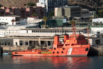 Fototapeta premium El Punta Salinas red port service vessel moored at harbor