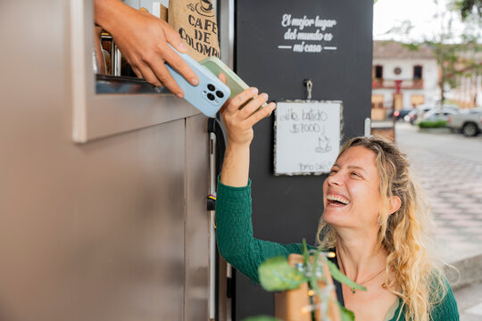 Mobile coffee truck serving a happy customer