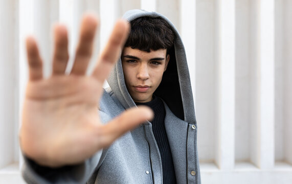 University student in casual attire focusing ahead