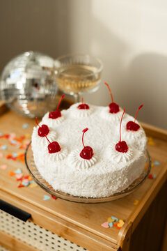 Sponge cake with cherries and cream cheese frosting