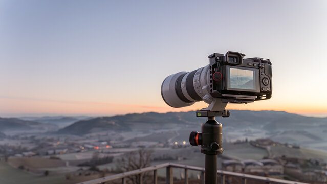 Camera capturing sunrise in Piamonte, Italy