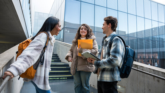 Students discussing academics outdoors on campus