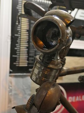 Front view of vintage bicycle acetylene headlight, also called carbide lamp, displayed as historical piece ion exhibition. 