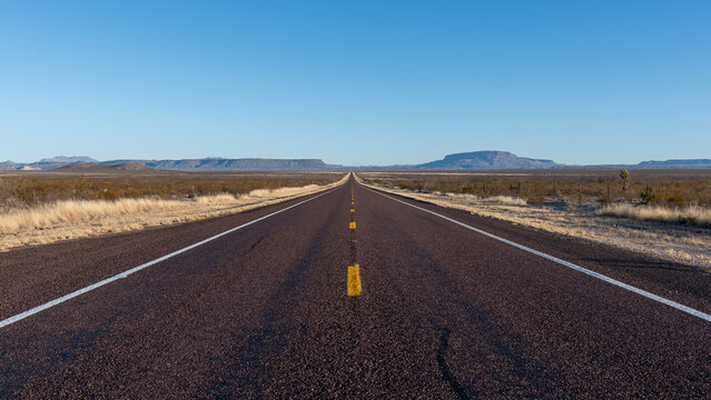 A long, straight road through the Chihuahuan Desert in southern Texas near Marfa