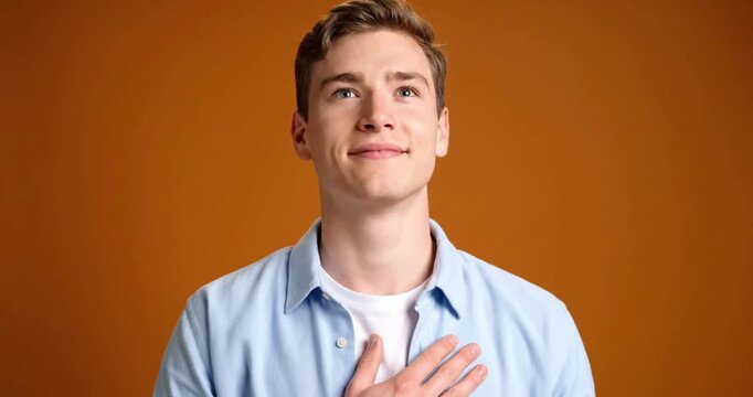 Young Man Showing Admiration and Respect with Thoughtful Expression
