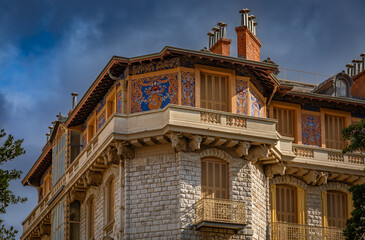 Ornate Belle Epoque building with colorful frescoes and bull heads, Nice, France © SvetlanaSF