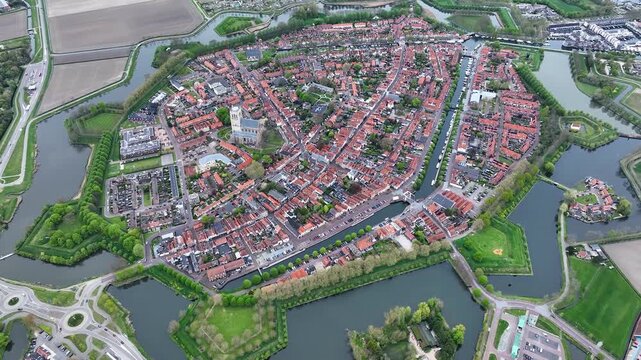 Aerial views of the historic fortified  town of Brielle, Den Briel, The Netherlands. View from the drone of star-shaped Fort Brielle showcasing canals, historic architecture, and vibrant cityscape