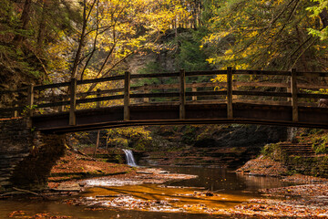 Sunlit Footbridge in Upper Buttermilk Falls Gorge