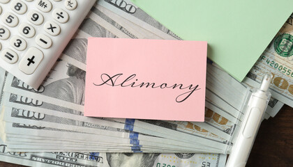 Note with word Alimony, dollars and calculator on wooden table, top view