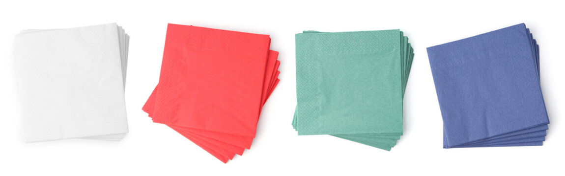 Paper napkins of different colors isolated on white, set. Top view