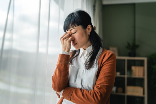 Woman experiencing headache and stress feeling tired and fatigued