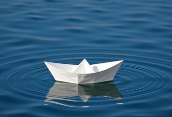 A small, pristine white paper boat floats on calm water,  origami boat,  white