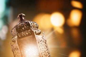 Dark silhouette of arabic lantern glowing