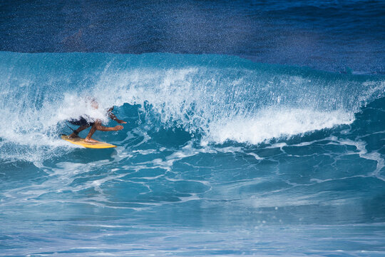 Surfer getting barrelled at Hookipa on Maui.