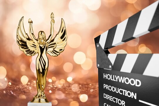 Shiny Golden award statue at ceremony background