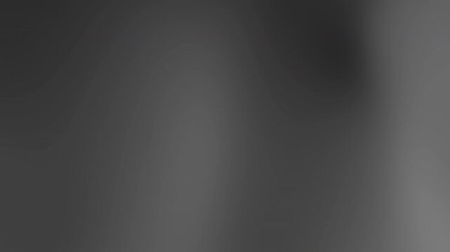A blurred gray background viewed from a straight-on perspective with soft gradations of tone and texture