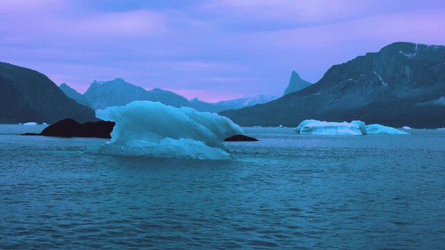 Iceberg and fjord seen from cruise ship vacation in Greenland near Nuuk