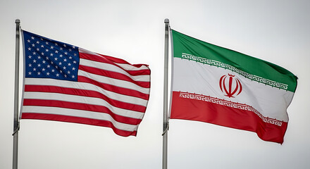 American and Iranian flags waving side by side against a neutral sky, symbolizing diplomacy and international relations in a tense political climate.