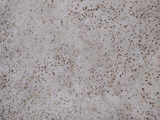 Obraz premium Elegant beige terrazzo texture with warm brown marble chips. High-quality seamless stone pattern for modern interior design and luxury backgrounds.