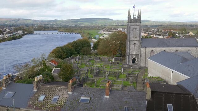 The River Shannon and St. Munchin&rsquo;s Church, the Church of Ireland. As seen from King John's Castle in Limerick, Ireland.