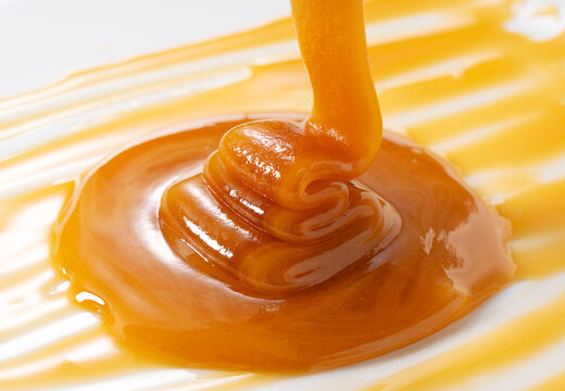 Dripping Manuka Honey in Macro View, Golden Viscous Texture of Premium Natural Honey