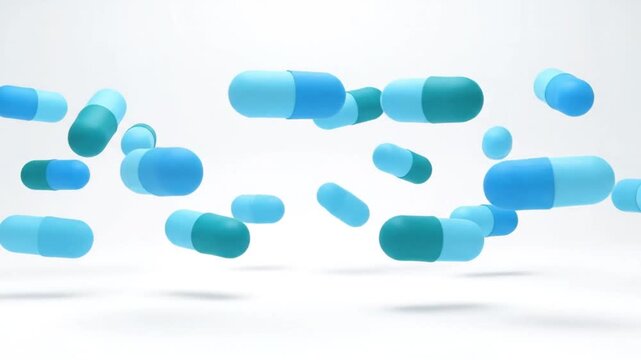 Blue Pills Falling on White Background.
