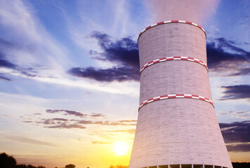 Cooling tower of nuclear power station against the sunset