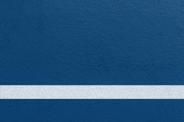 Tennis court surface background with blue textured ground and a clean white court line © natrot