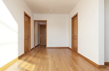 Fototapeta premium Empty apartment living room with polished oak flooring, wooden doors. Space features minimalist design, bright natural light. Represents blank canvas for interior decoration home staging concepts.