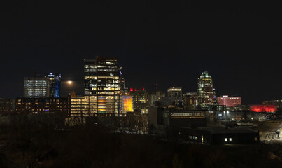 Naklejka premium Raleigh, North Carolina, United States of America - February, 3rd, 2026: Downtown Raleigh cityscape at night, from Boylan street bridge.