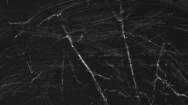 Vintage Scratched Black Film Texture Overlay, Distressed black surface with white scratches, dust, and worn film fold marks