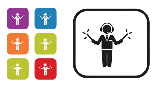 Air traffic controller figure giving landing instructions holding illuminated signal wands and headset