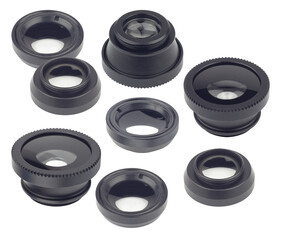 a diverse set of interchangeable macro lenses for smartphones, showcasing various sizes and designs with clear glass elements and black threaded mounts, presented on a plain black backdrop.