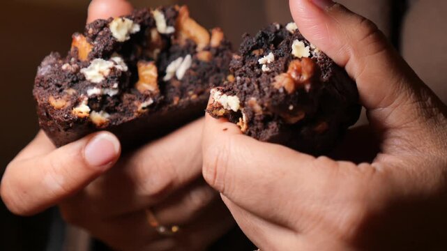 Enjoying a warm chocolate chip cookie in the kitchen