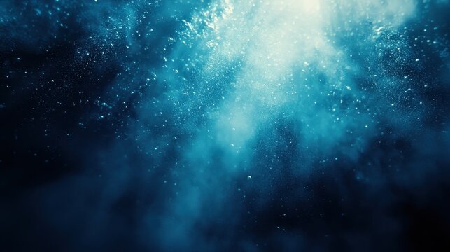 Abstract underwater scene with glowing light and shimmering particles in deep blue water