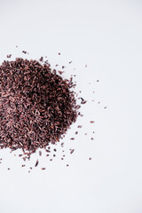 Black sticky rice grains isolated on white background
