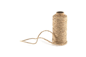 Spool of natural jute twine on a white background, ready for crafting and packaging projects