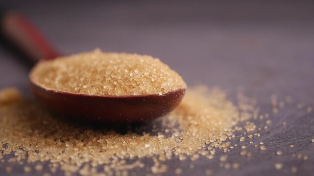 Brown sugar on a wooden spoon close up