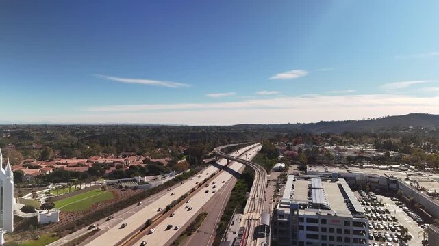 Urban traffic moves steadily along Interstate 5 in San Diego, California. A realistic view of city transportation, freeway infrastructure, and daily vehicle movement in a major metropolitan area.